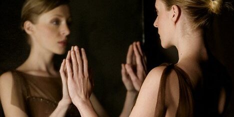 Woman Looking at Reflection